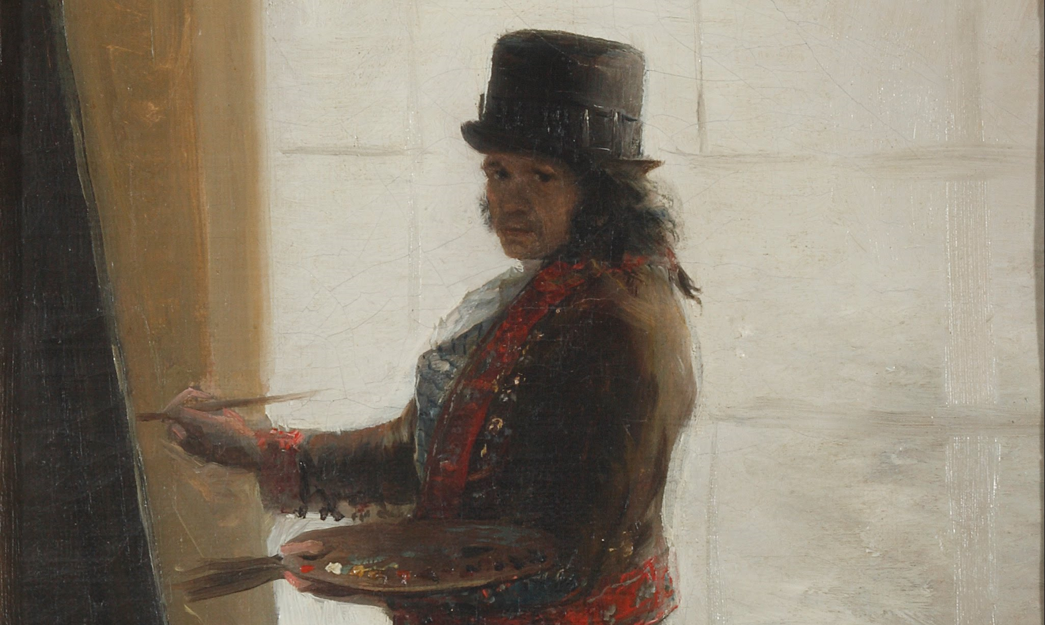 Francisco Goya, Autoportrait dans l’atelier : l’artiste se tient debout en train de peindre, une palette dans une main et un pinceau dans l’autre. Il est vêtu d’un costume évoquant celui des toreadors et porte un chapeau.